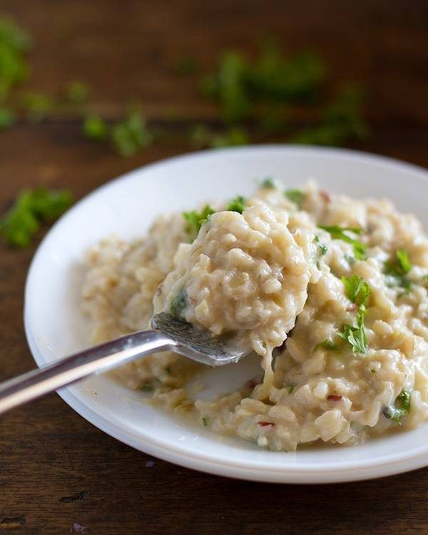 This creamy cauliflower garlic rice is simple, healthy, and so surprisingly good! With garlic, butter, brown rice, and cauliflower. | pinchofyum.com This creamy cauliflower garlic rice is simple, healthy, and so surprisingly good! With garlic, butter, brown rice, and cauliflower. | pinchofyum.com