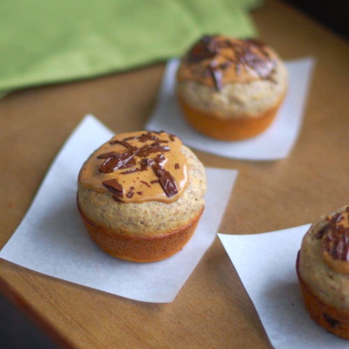 Peanut butter banana flax muffins on parchment paper.