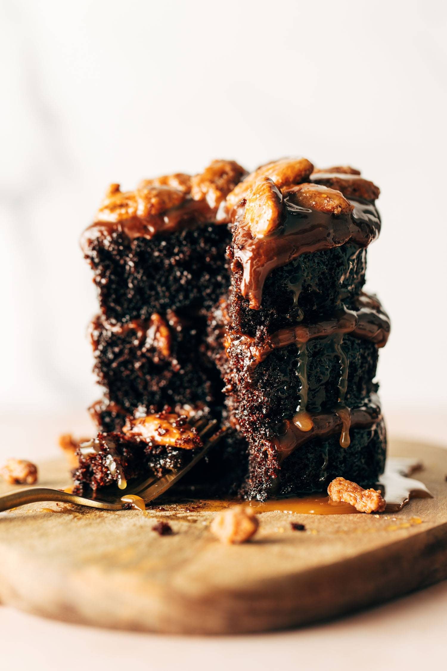 Cafe Latte turtle cake with a slice taken out of it and a fork next to the cake